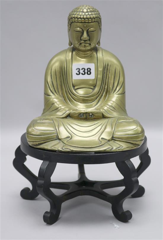 A Chinese brass figure of a seated Buddha, early 20th century,